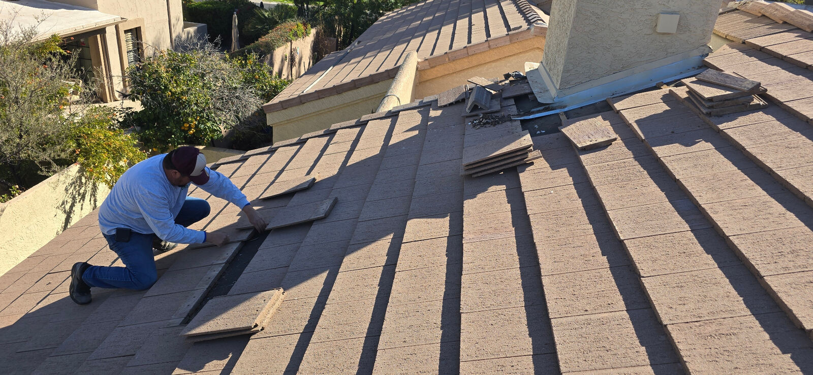 Concrete tile · Mesa · February 2026 — Recurring leak traced back to failed flashing at a chimney and adjacent plane — not the wet spot on the ceiling.