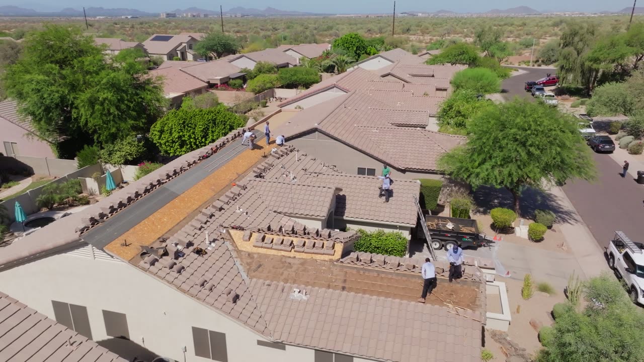 KY-KO Roofing crew performing a roof repair on a Phoenix home