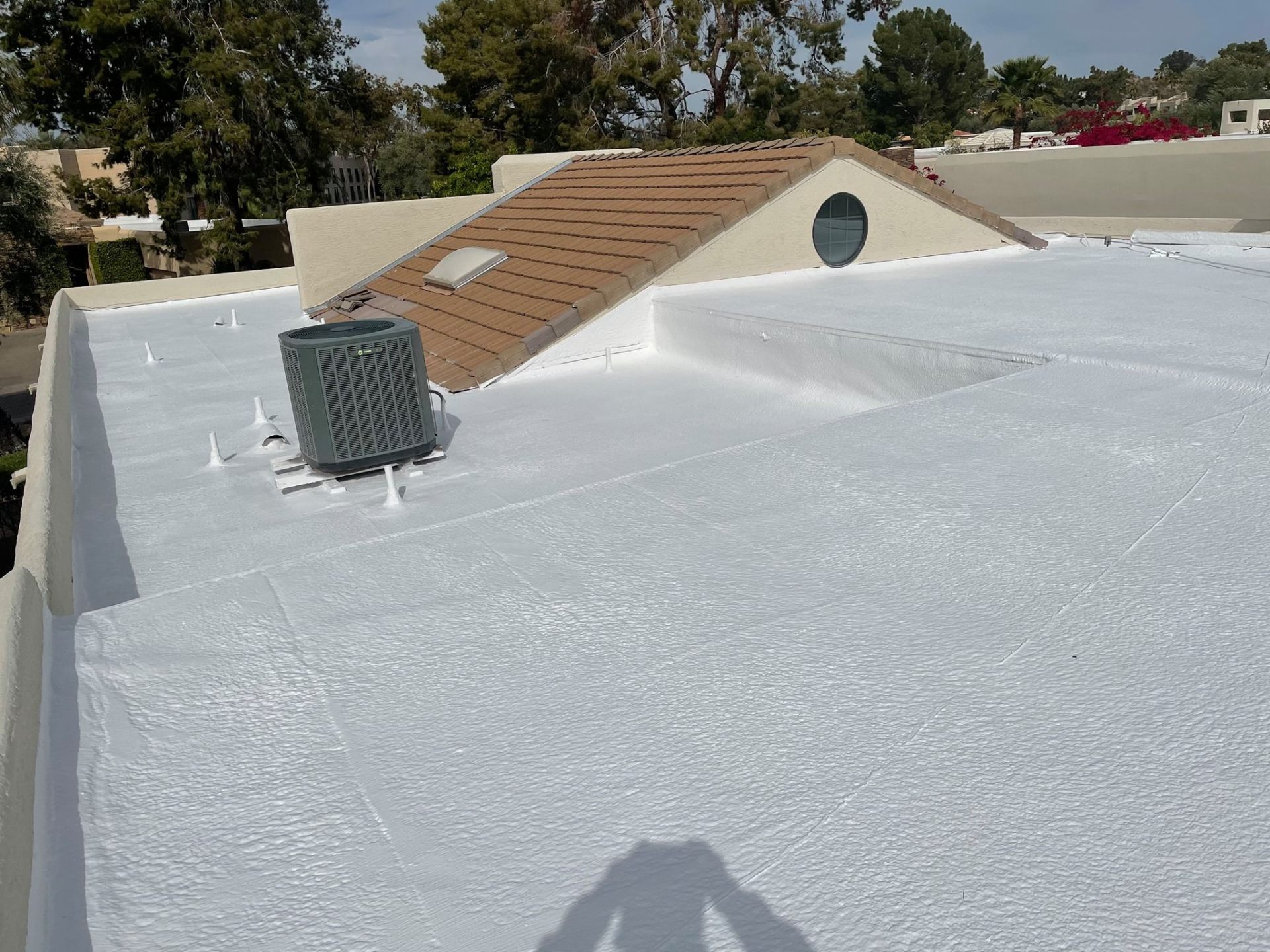 Flat roof · Phoenix · January 2026 — Leak at an AC curb after a rooftop unit swap — sealant had cracked and lifted from the flashing.