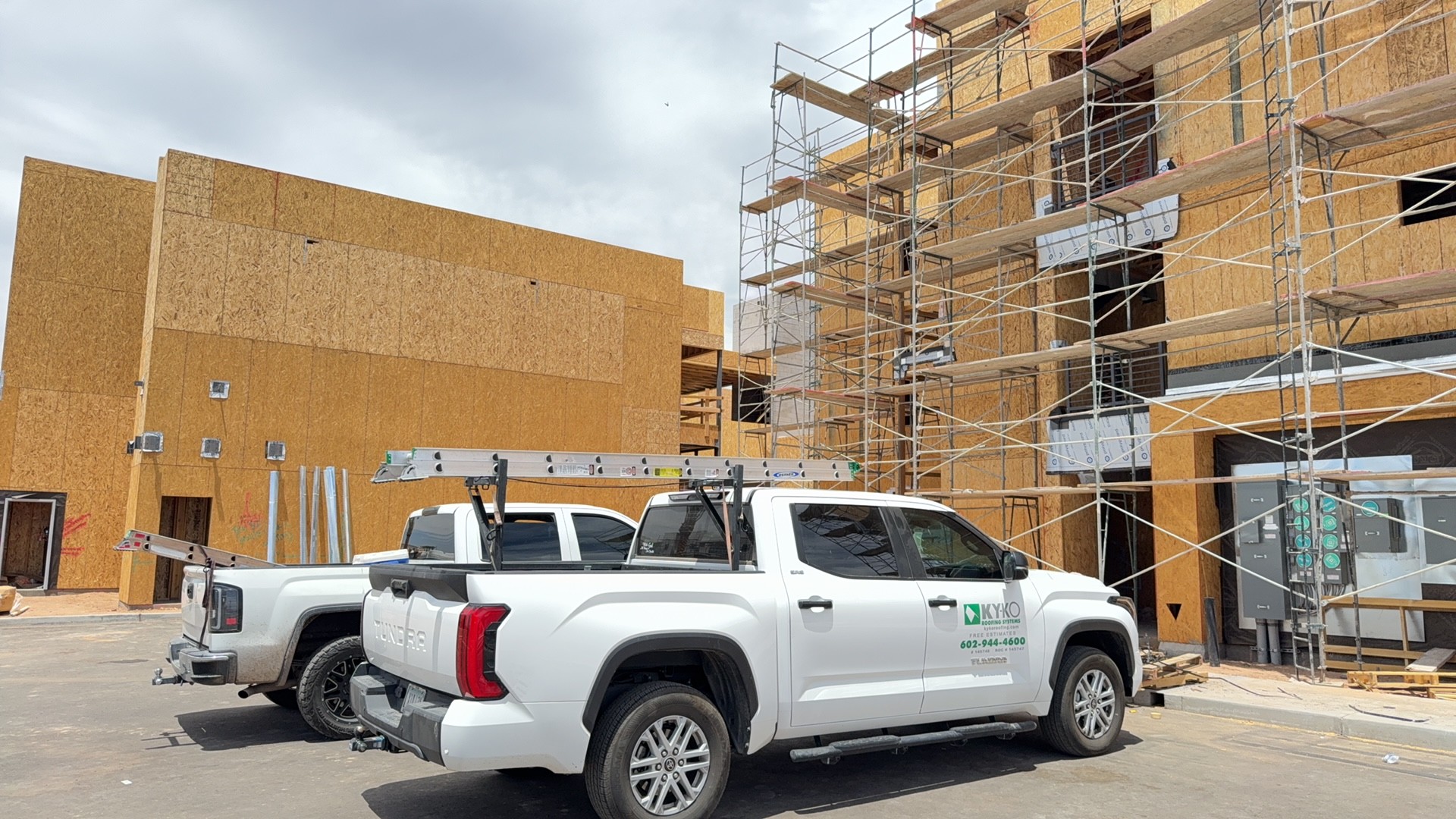 KY-KO truck on a multi-story new construction site in Surprise 85374