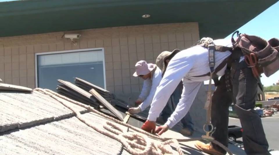 KY-KO's technicians working on a roof